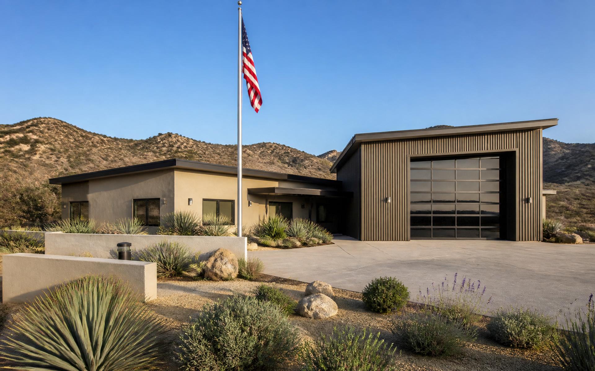 Modern Southern California fire station with drought-tolerant landscape, flag pole and chaparral hills, representative imagery